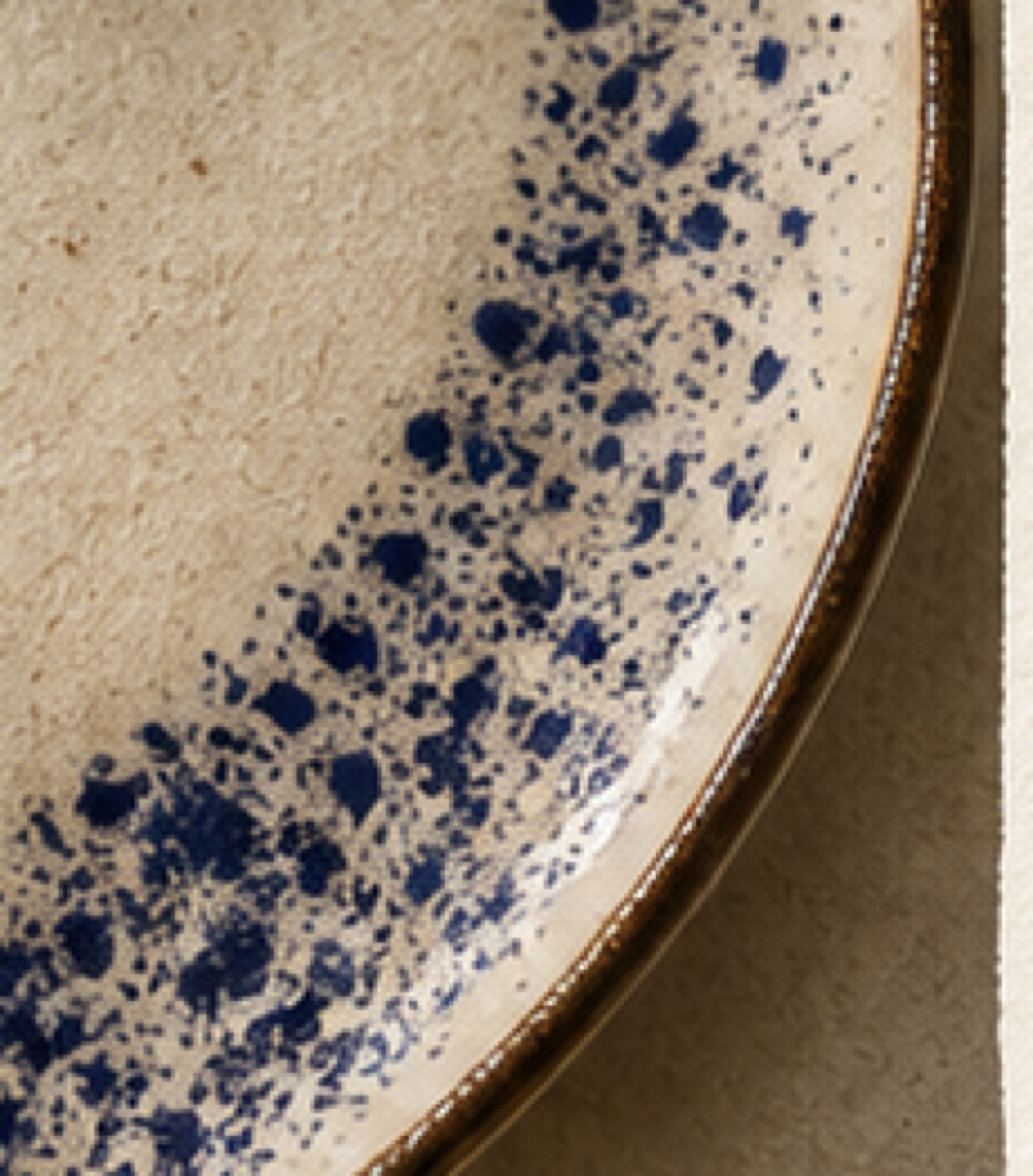 Speckled blue ceramic plate